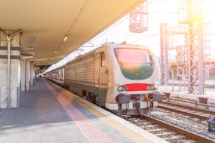 City railway station, train waiting for passengers before departure.