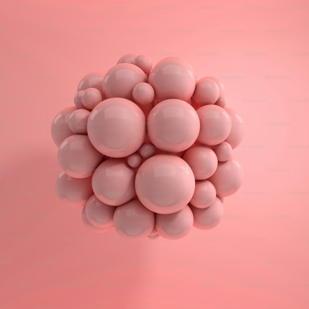 분홍색 배경에 떠 있는 광택 구체의 3d 렌더링. 추상적인 기하학적 구성. 부드러운 그림자가 있는 분홍색 파스텔 색상의 공 그룹
