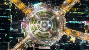 Aerial view beautiful pattern highway road intersection at night  for transportation, distribution or traffic background.