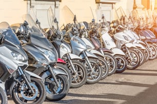 Row of scooters for sale and rental on the streets