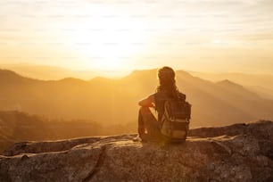 Hiker meets the sunset on the Moro rock in Sequoia national park, California, USA.