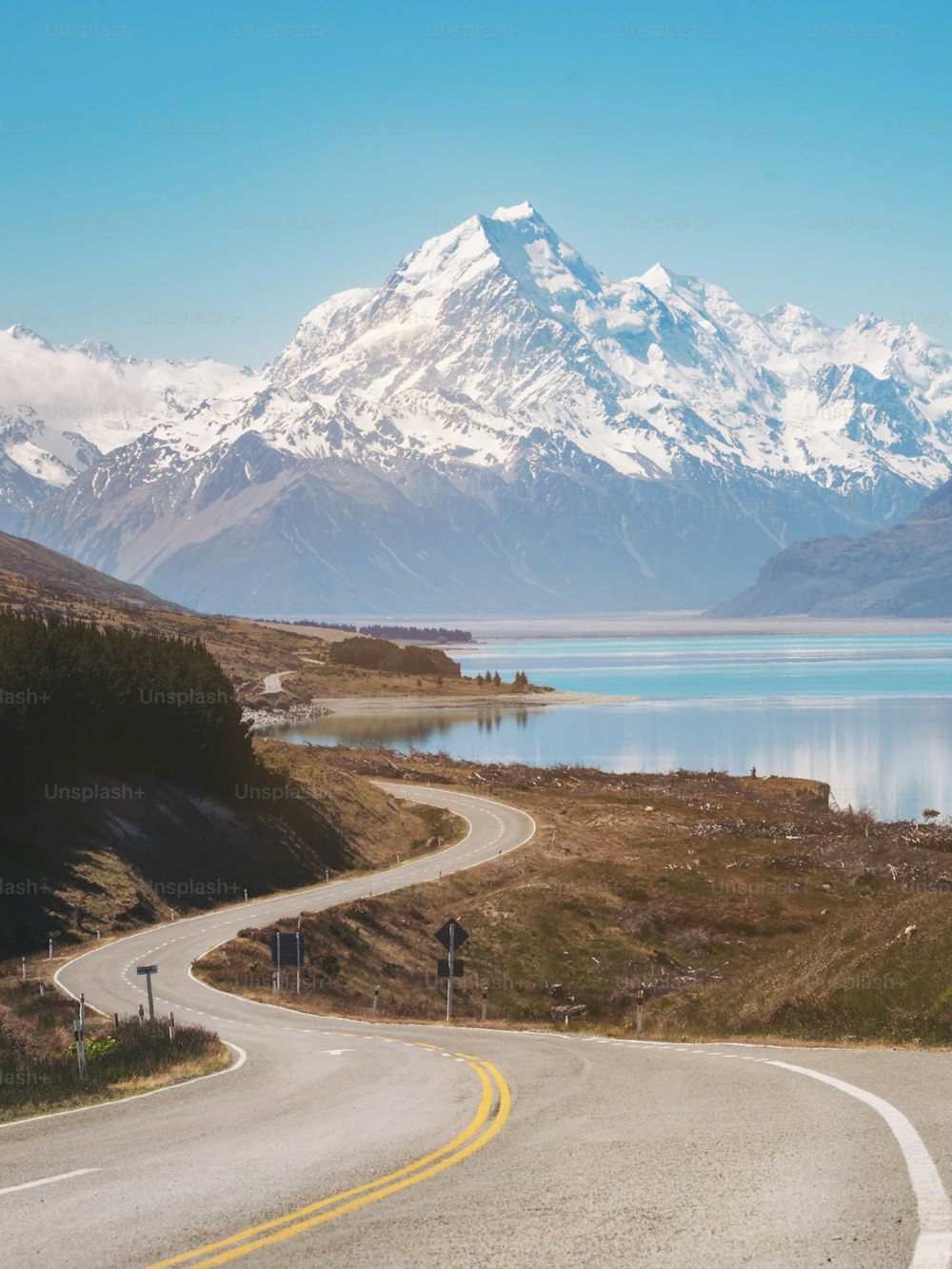 Road to Mount Cook, the highest mountain in New Zealand. A scenic highway drive along Lake Pukaki in Aoraki Mount Cook National Park, South Island of New Zealand. Shot at Highway 80 (Mt Cook Road).