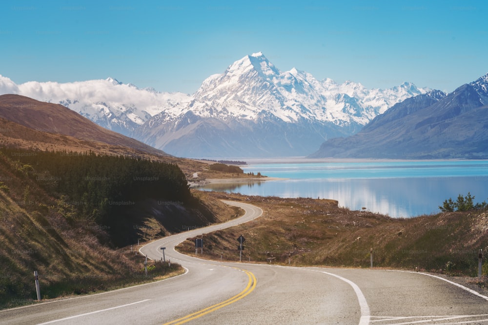 Road to Mount Cook, the highest mountain in New Zealand. A scenic highway drive along Lake Pukaki in Aoraki Mount Cook National Park, South Island of New Zealand. Shot at Highway 80 (Mt Cook Road).