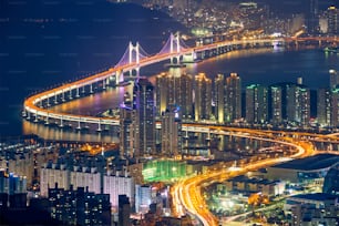 Busan cityscape with skyscrapers and Gwangan Bridge illuminated at night. Busan. South Korea