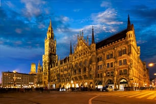 Marienplatz central square illuminated at night with New Town Hall (Neues Rathaus) - a famous tourist attraction. Munich, Germany