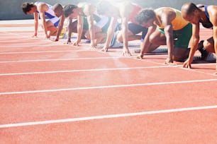 a group of people standing on top of a race track