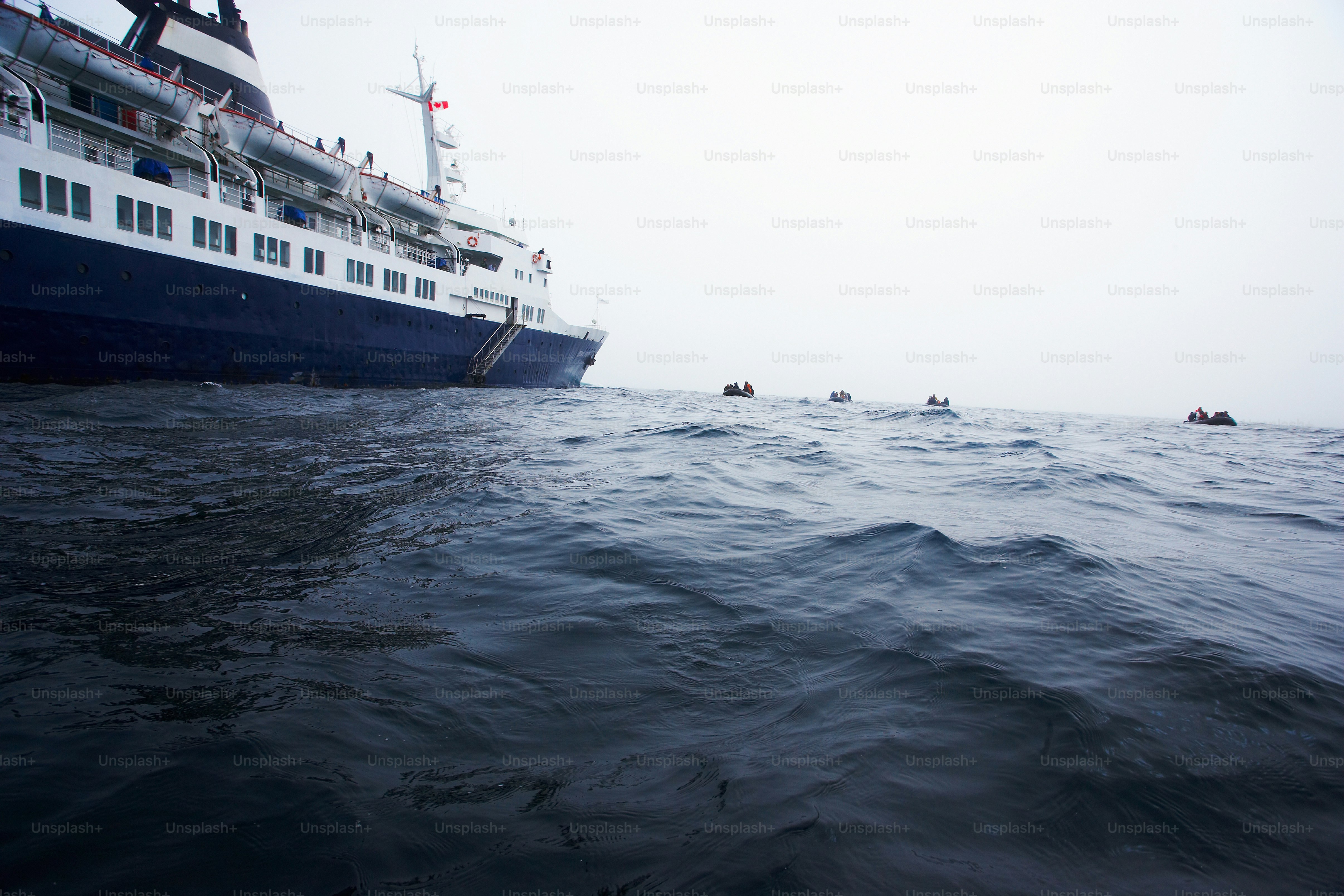 a large boat in the ocean with people in it