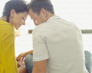 a man and a woman sitting next to each other