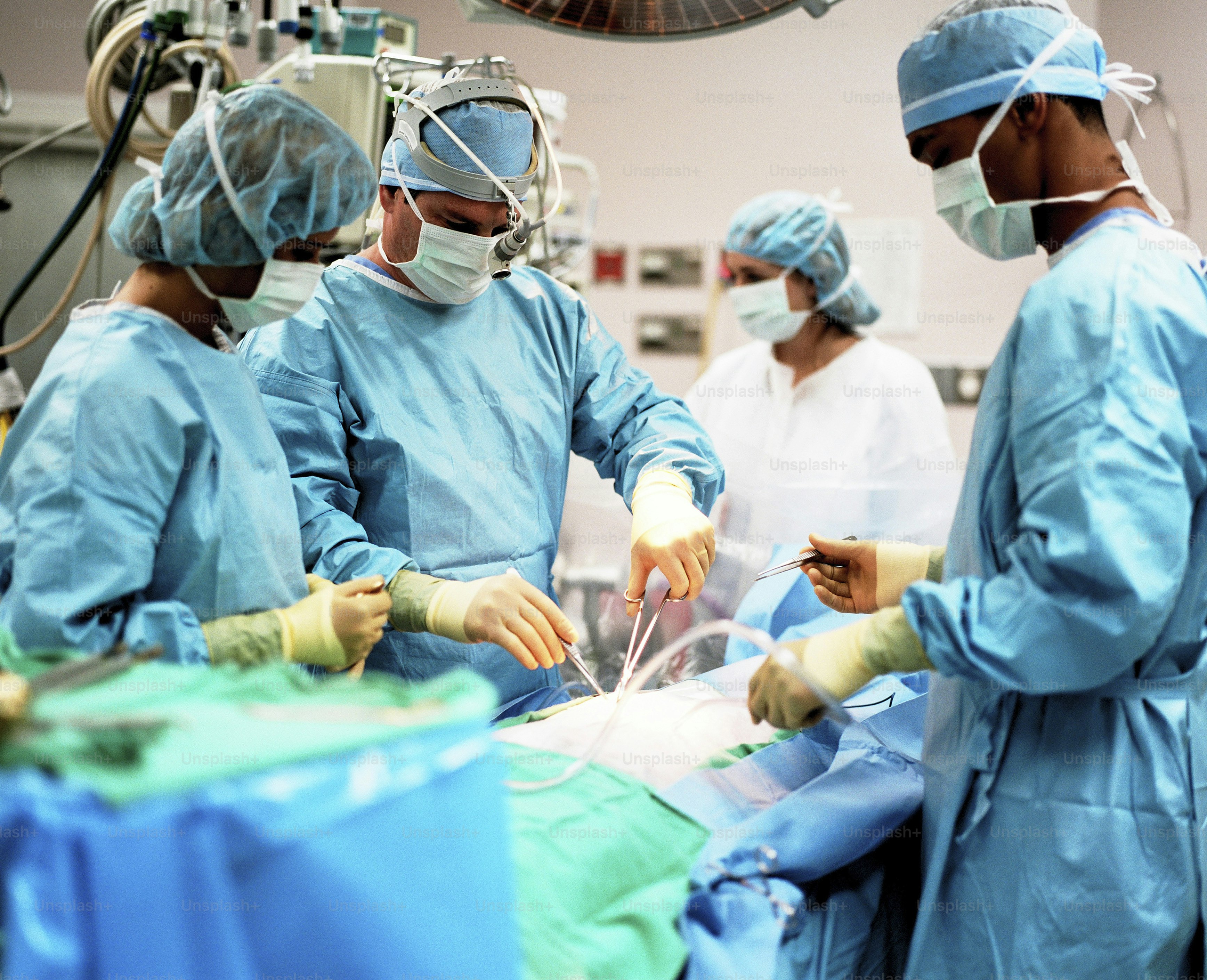 a group of doctors performing surgery in a hospital