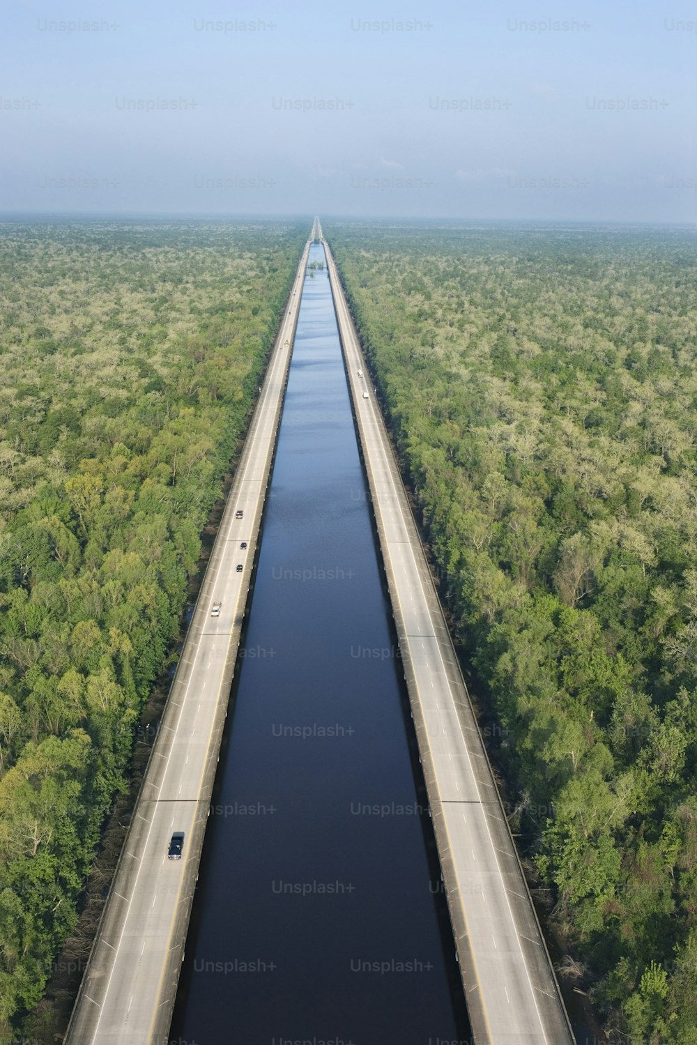 an aerial view of a bridge over a river