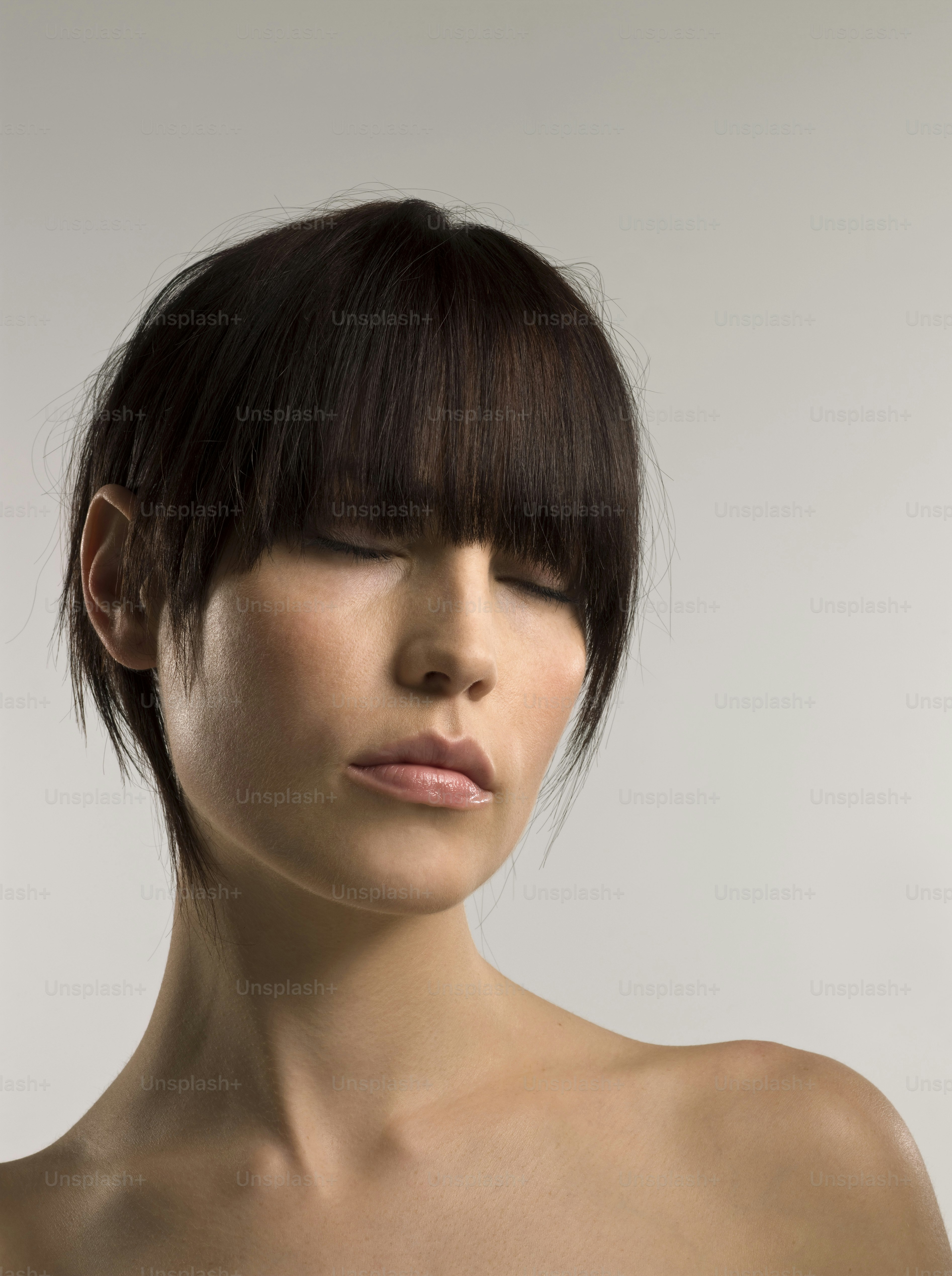 a close up of a woman with short hair