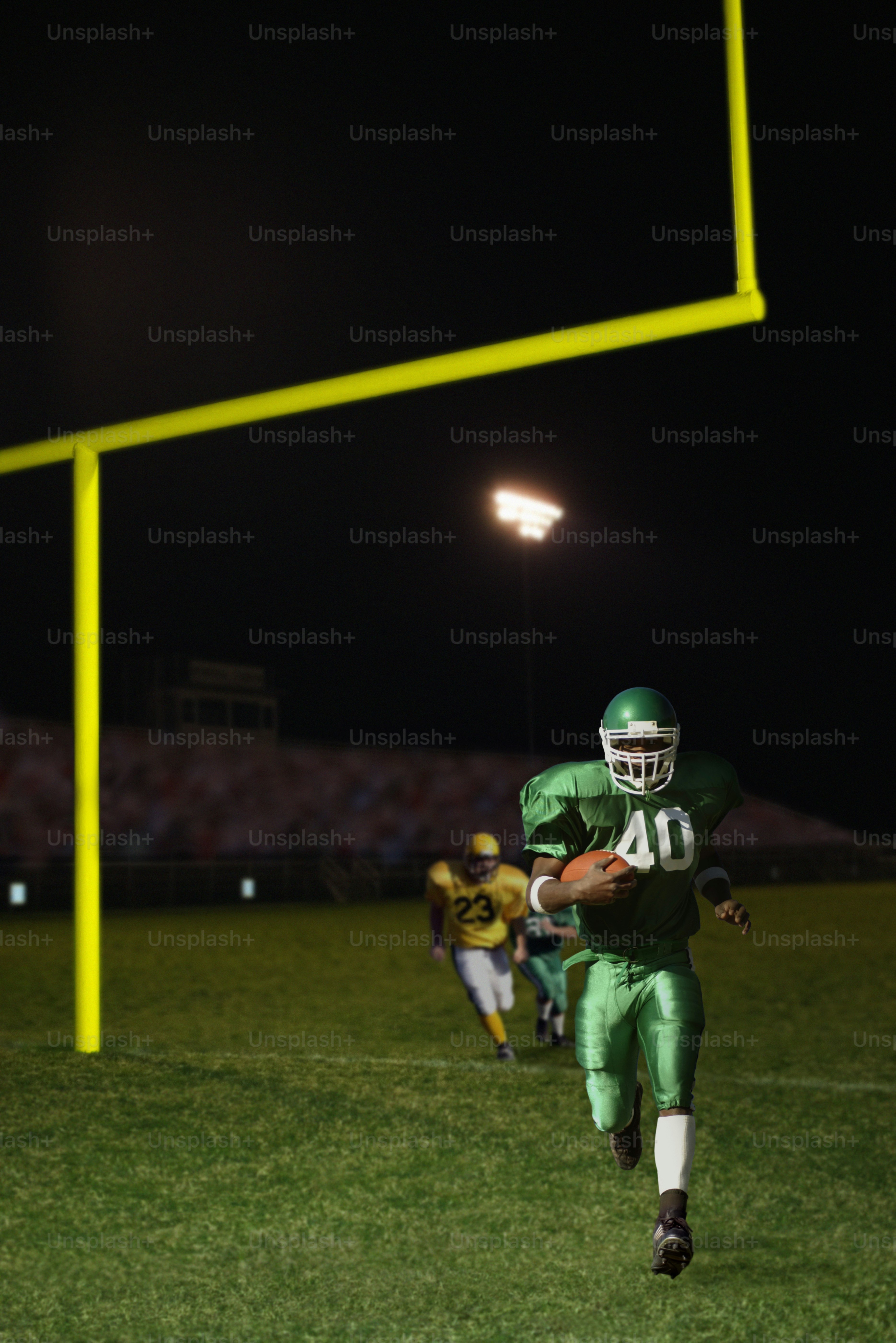 a football player is running with the ball