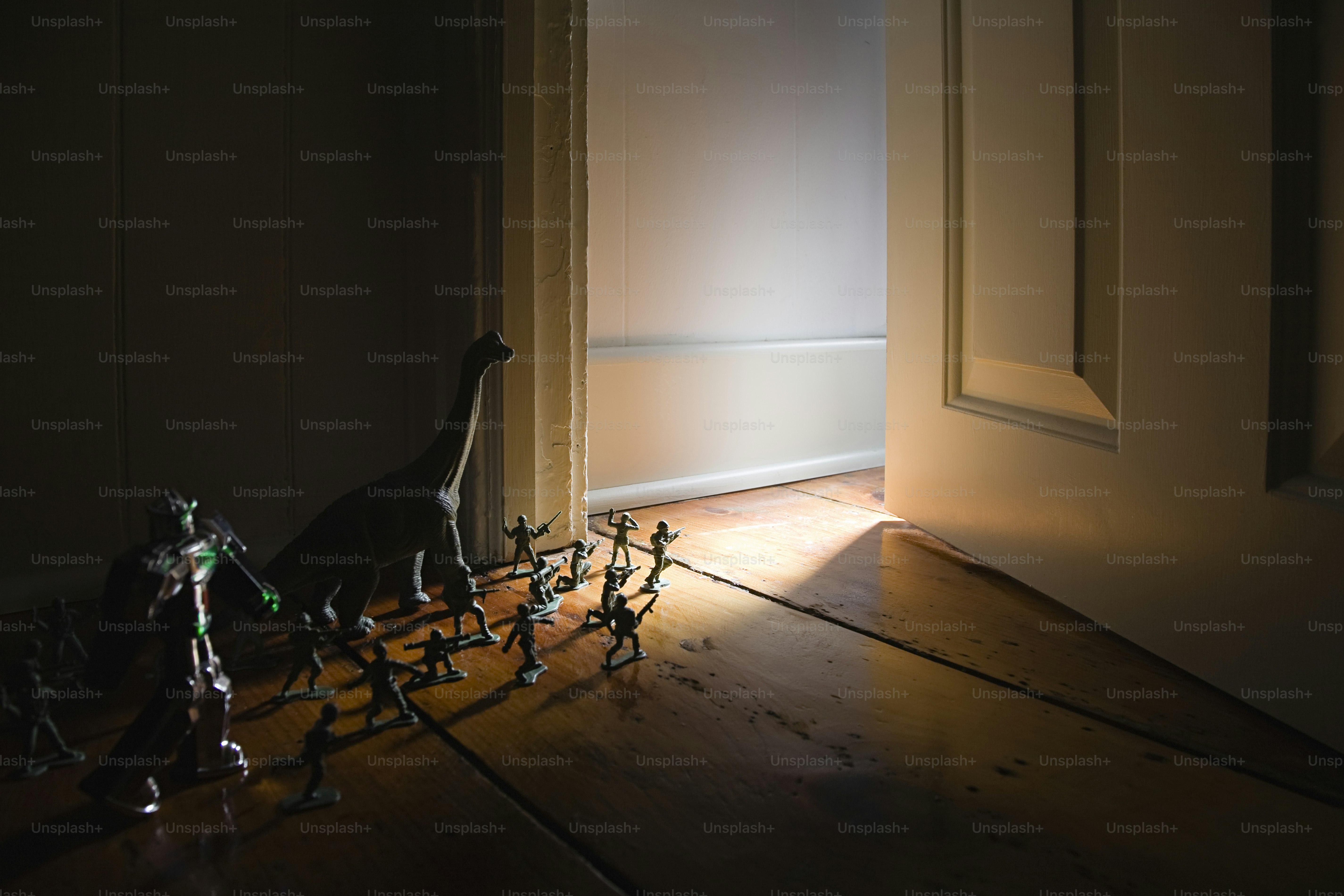 a group of toy people standing in front of a door