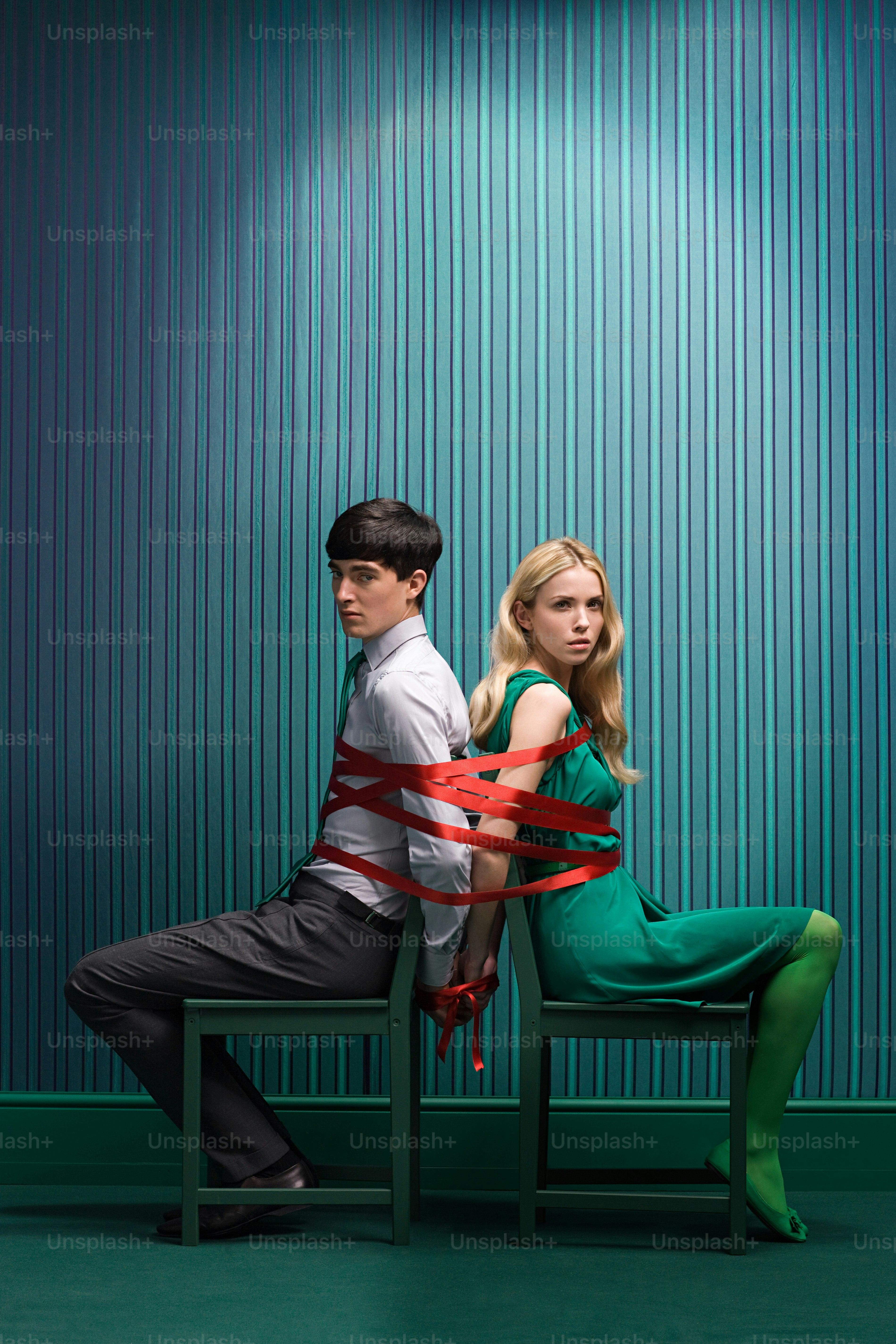 a man and a woman sitting on a chair