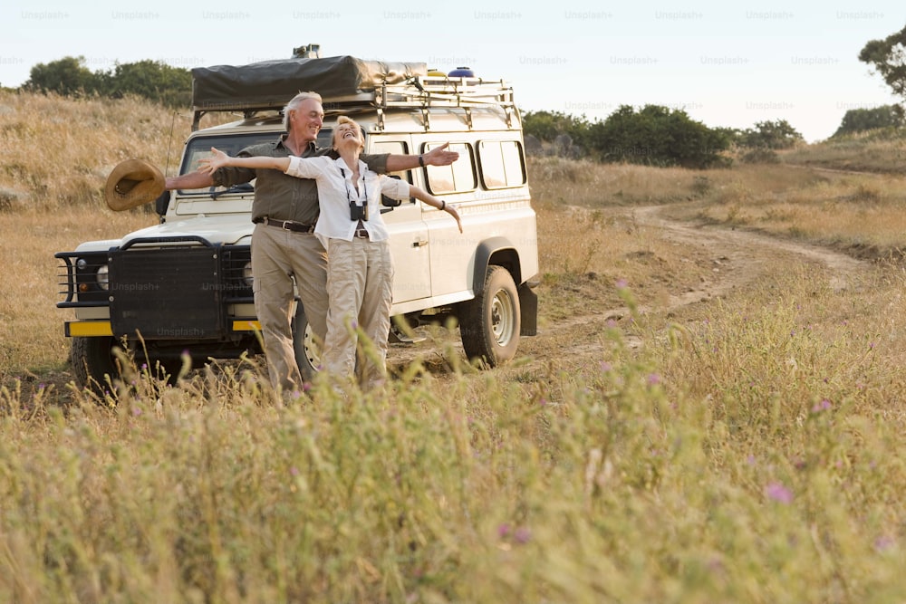 a couple of men standing in front of a truck