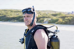 a man wearing a scuba suit and goggles