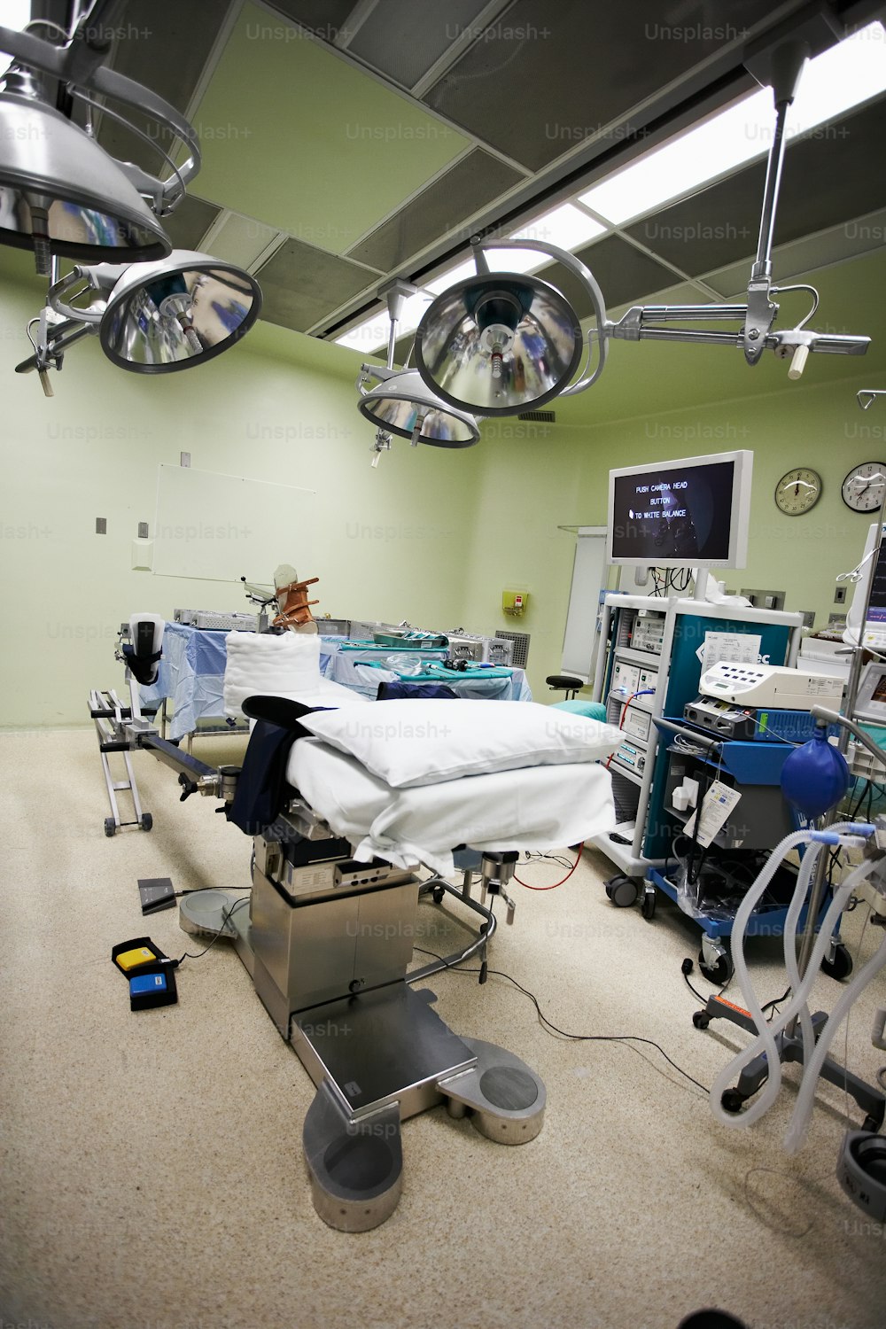 a hospital room with medical equipment and lights