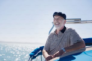 a man sitting on top of a boat on a body of water