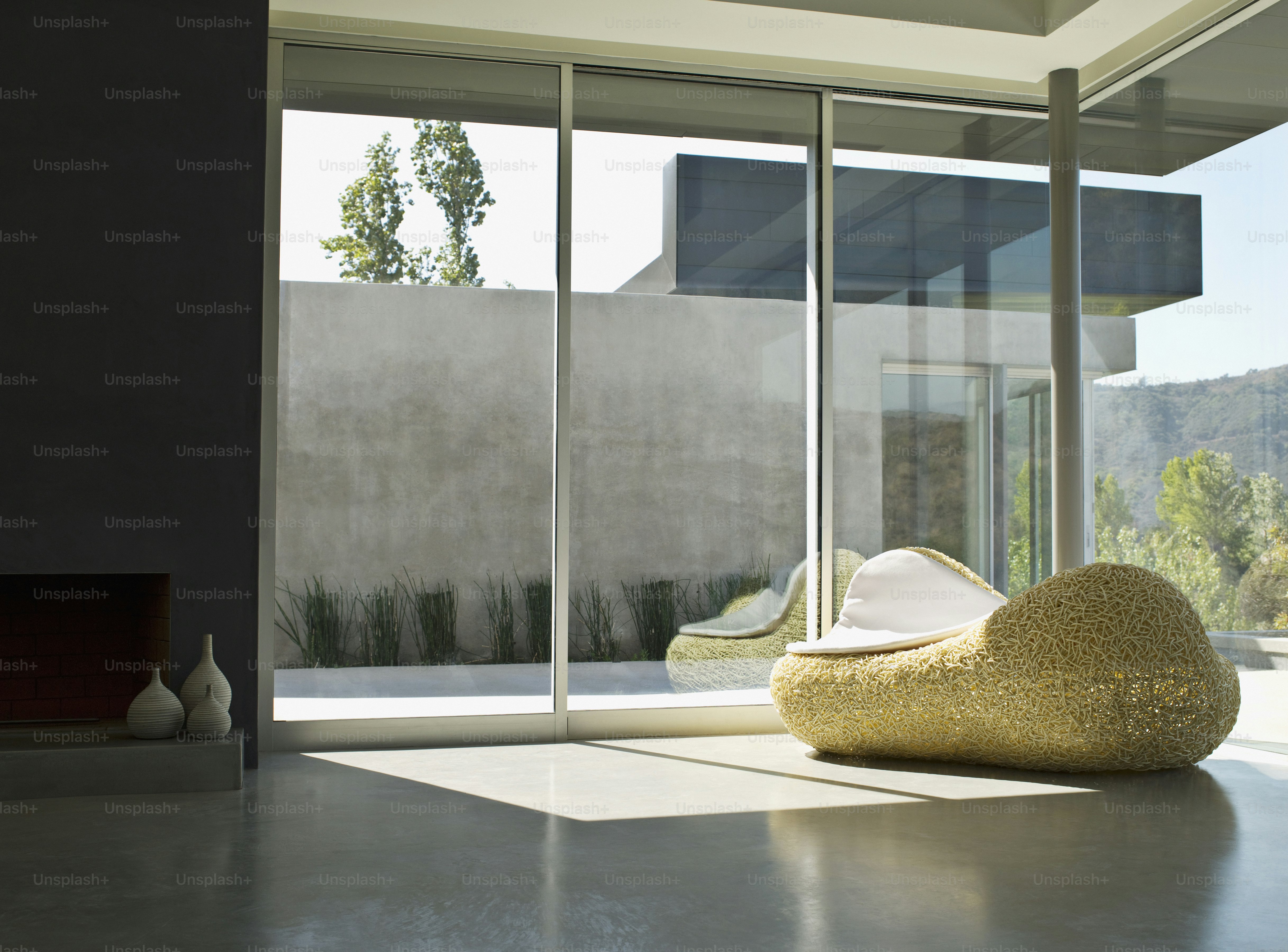 a living room filled with furniture and a large window