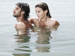 a man and a woman are in the water