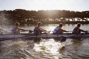 a group of people riding on the back of a boat