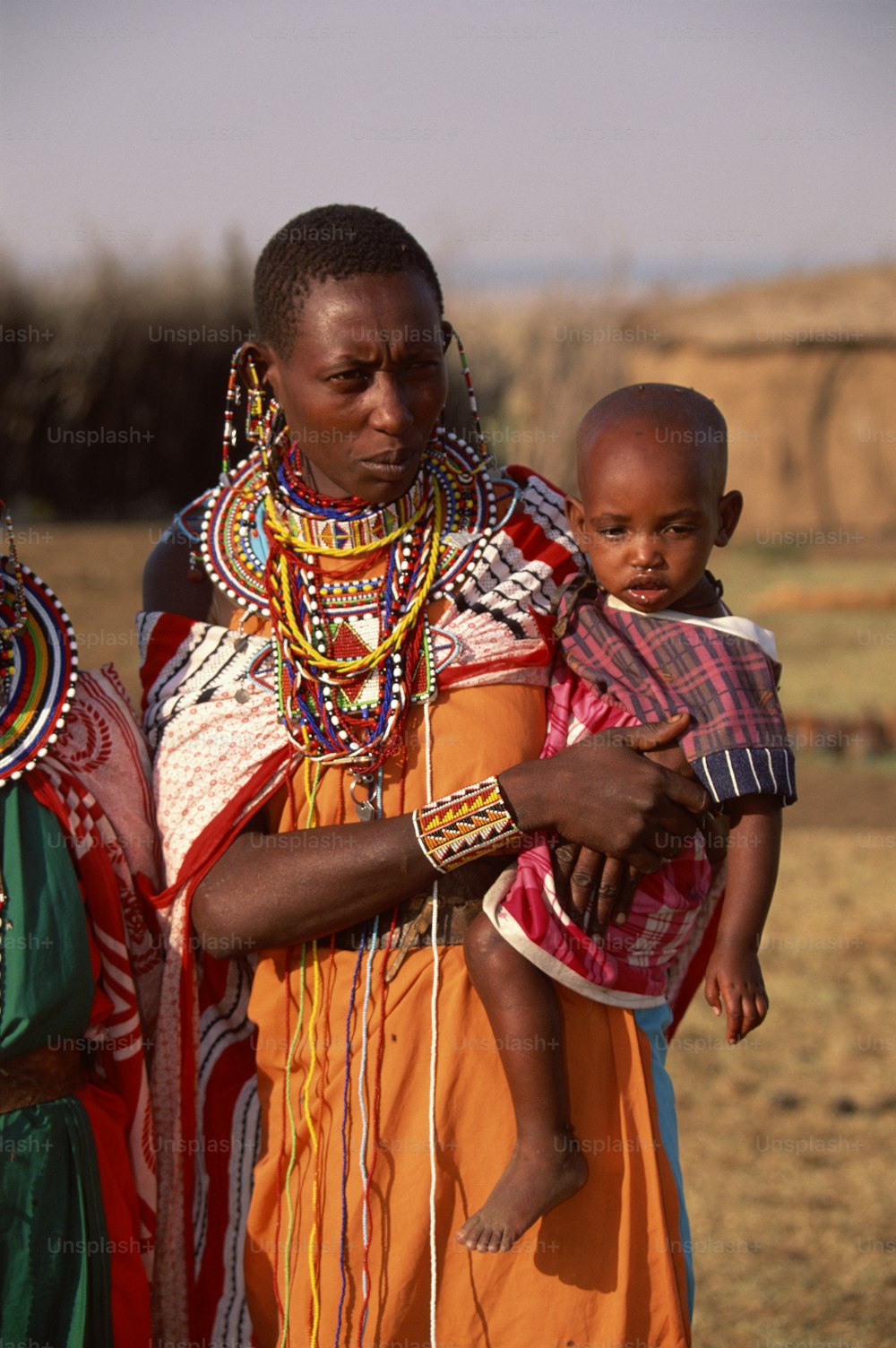 a woman holding a child in her arms