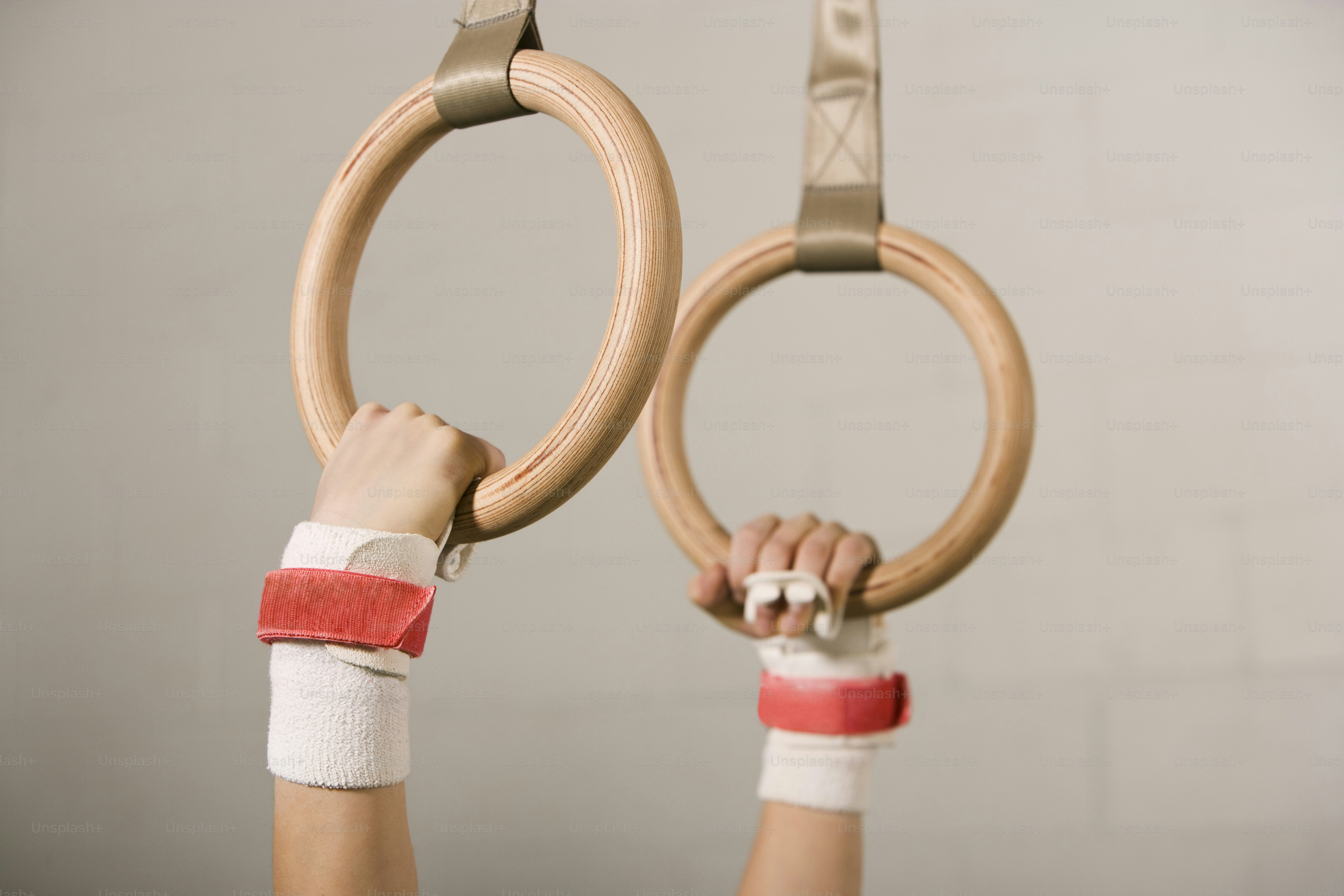 a person holding a pair of rings in their hands