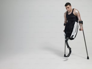 a man with crutches and a cast on his leg