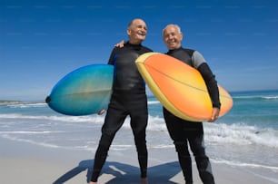 a couple of men standing next to each other on a beach