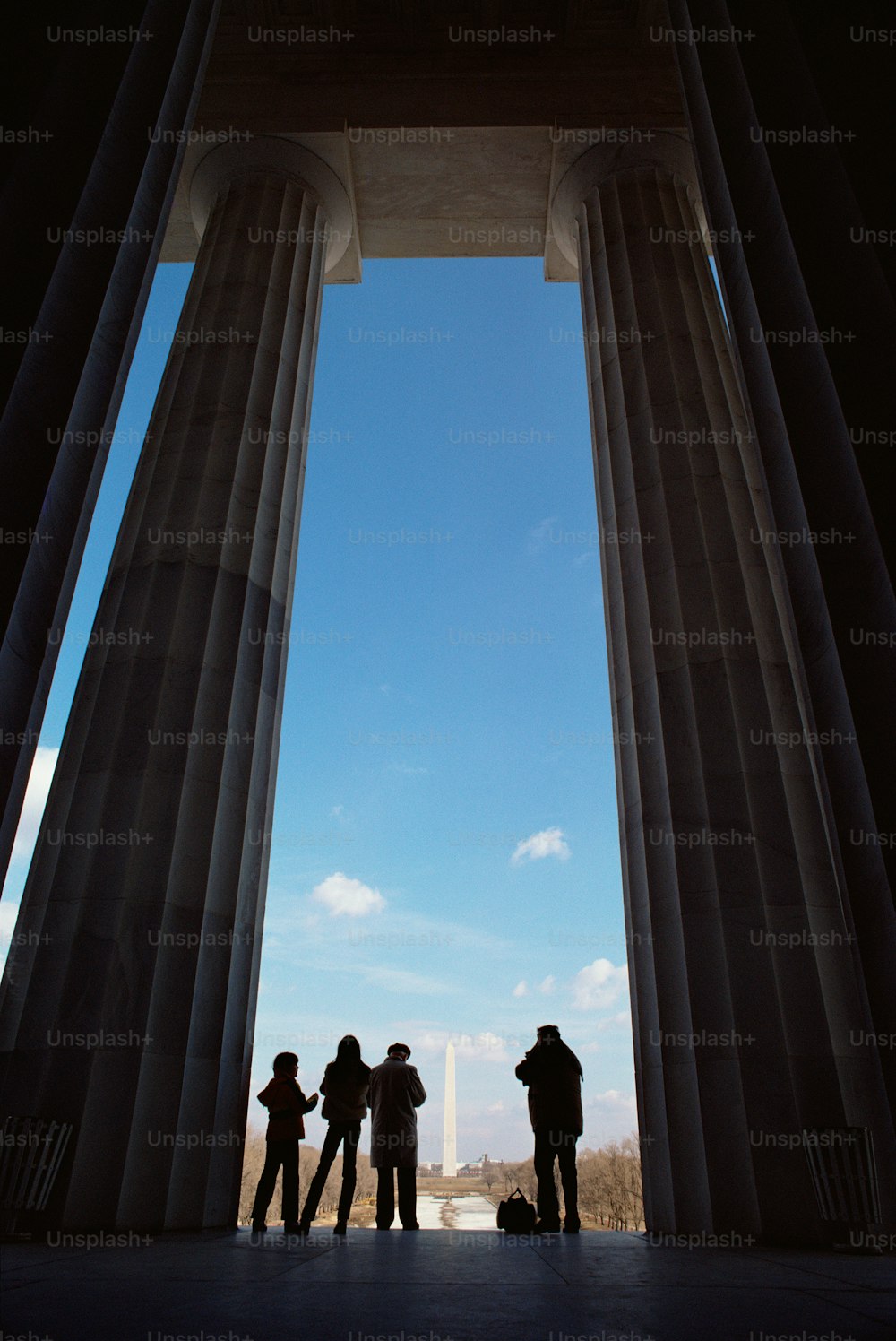 a group of people standing in front of a tall building