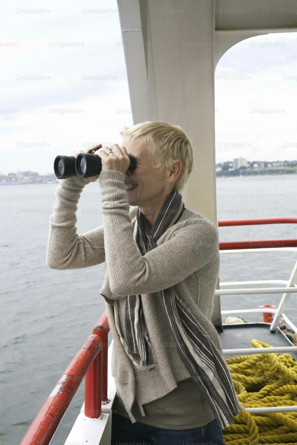 a woman looking through a pair of binoculars
