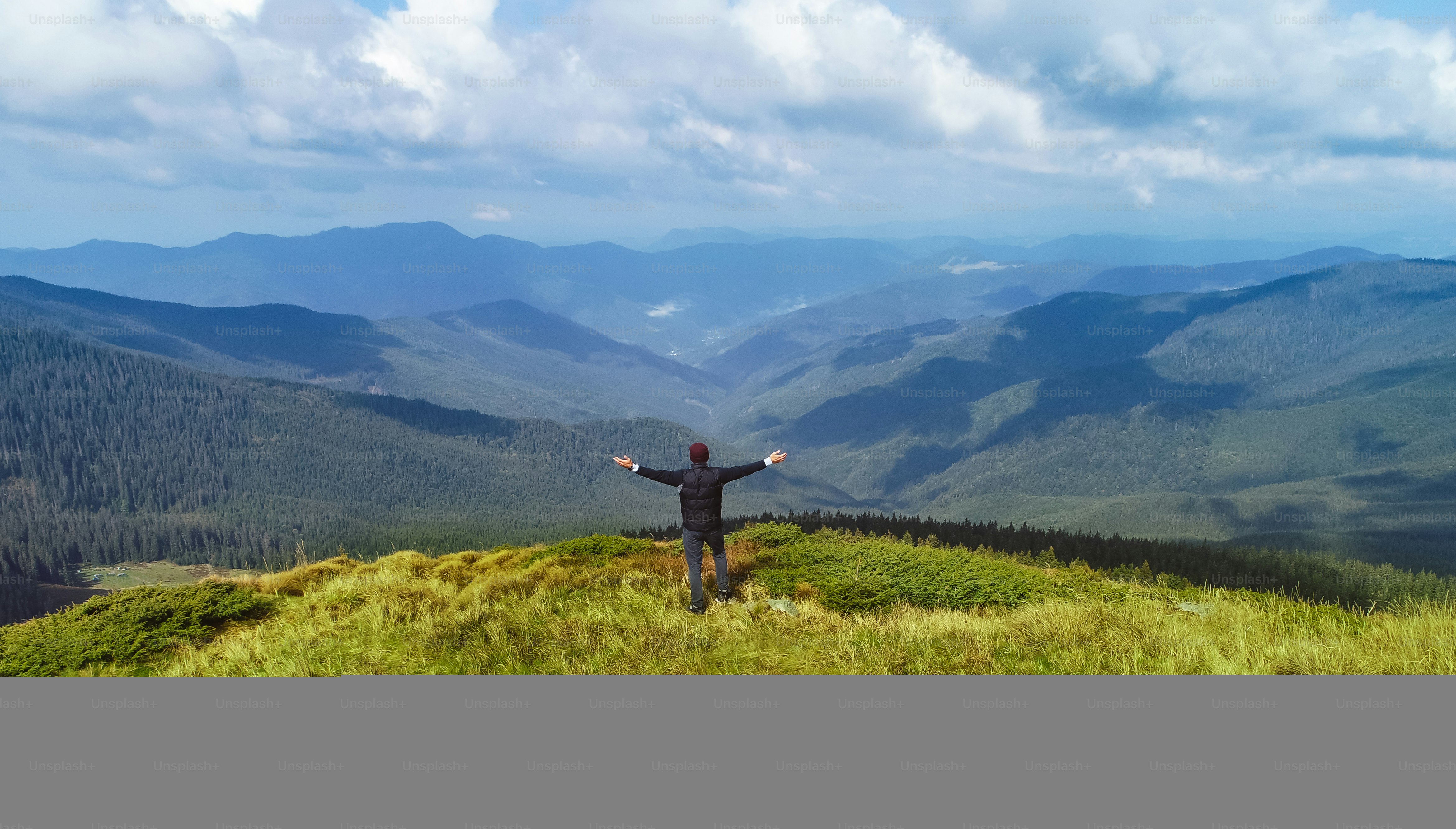 The man standing on the picturesque mountains background