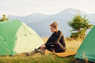 Girl in black wear. Majestic Carpathian Mountains. Beautiful landscape of untouched nature.