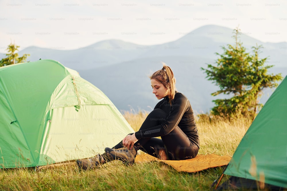 Girl in black wear. Majestic Carpathian Mountains. Beautiful landscape of untouched nature.