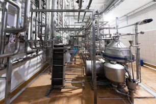 filter system at a large beer company. Water tank reverse osmosis water system with equipment and piping systems to supply the manufacturing process in factory of the plant. Modern filter system
