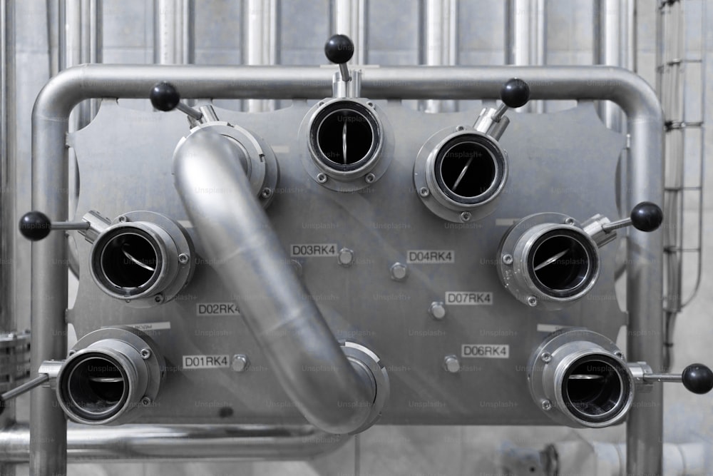 Gray metal panel with toggle levers and inscriptions to them close-up. Industrial plant inside view