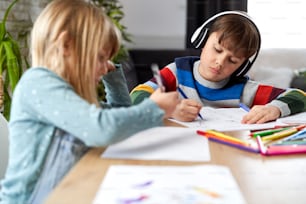 Brother and sister doing homework together