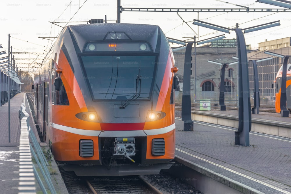 Suburban passenger train arrives at the main station of the city