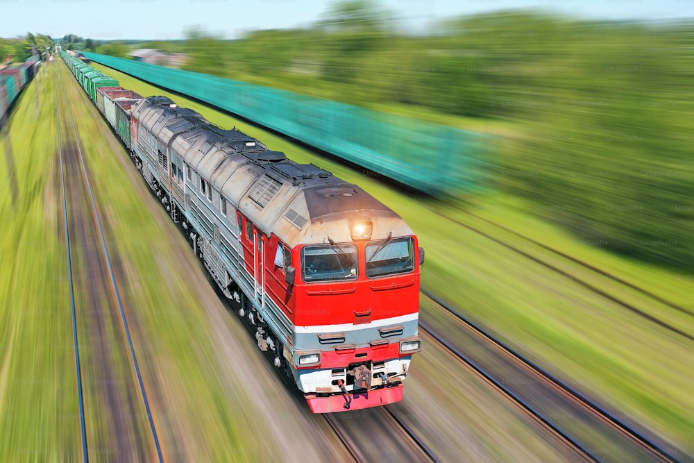 Freight train going in a hurry along the train at high speed. Railway Transport Concept
