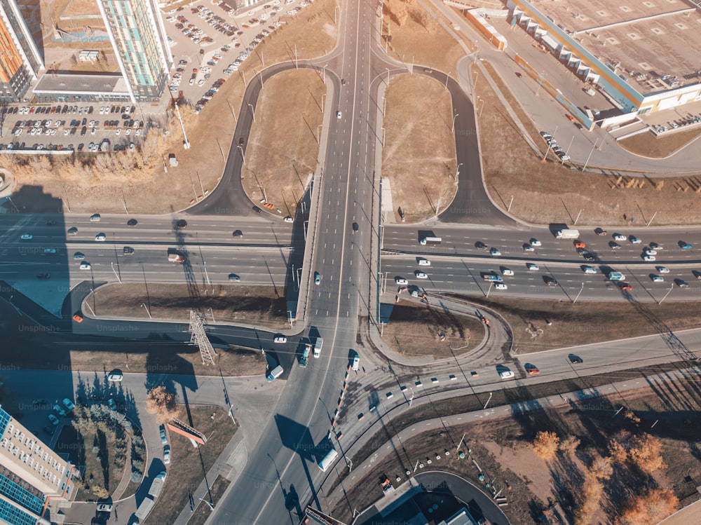 City crossroads and overpasses with traffic aerial view. Transport in the busy city concept
