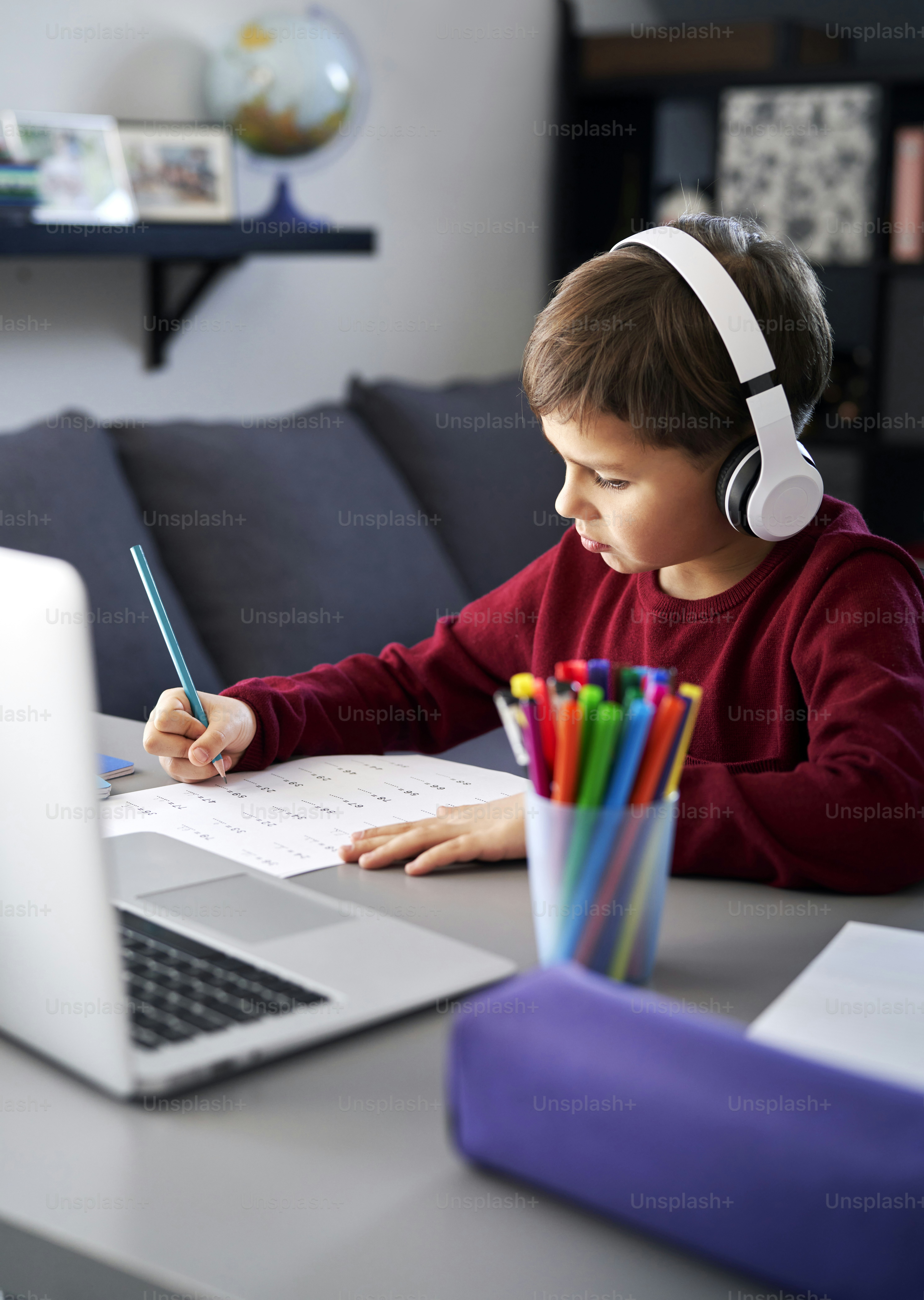 Happy boy with his mother during doing homework photo – Woman Image on ...