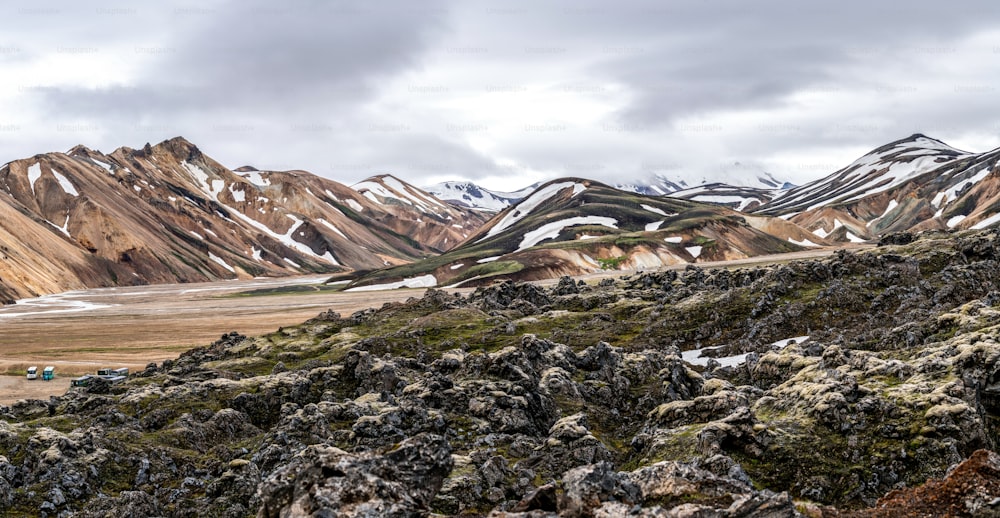 Landscape of Landmannalaugar surreal nature scenery in highland of Iceland, Nordic, Europe. Beautiful colorful snow mountain terrain famous for summer trekking adventure and outdoor walking.