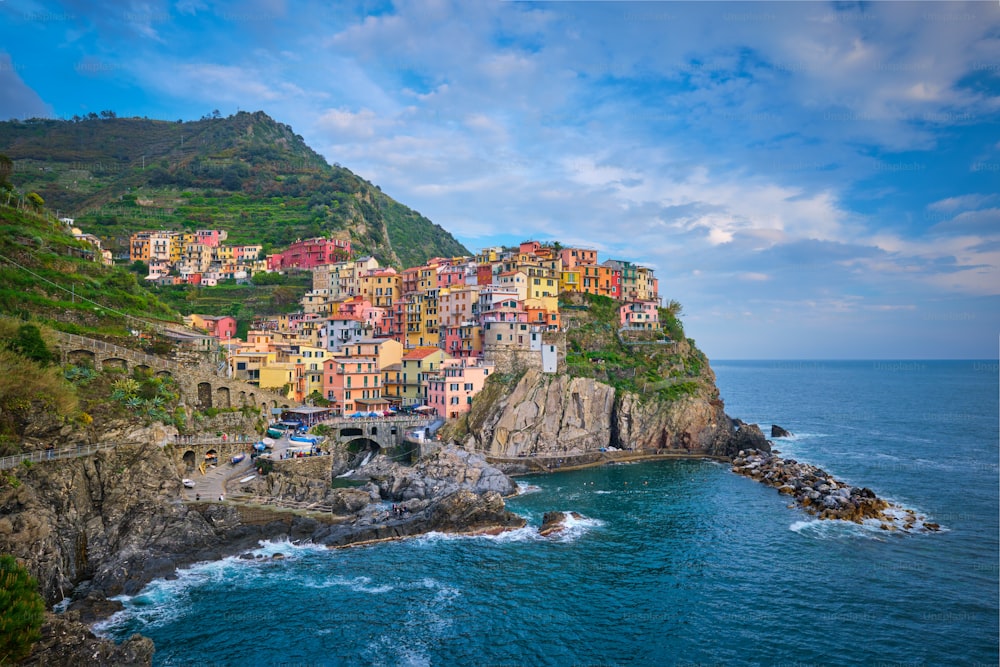 Famous italian landmark Manarola village popular european italian tourist destination in Cinque Terre National Park UNESCO World Heritage Site, Liguria, Italy on sunset