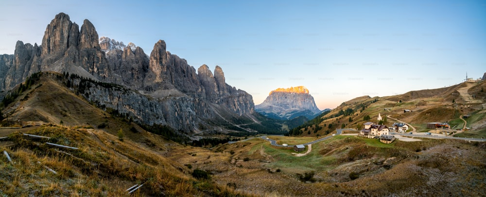 Dolomites Italy Panoramic Landscape. Sunrise shines on Sassolungo Langkofel Group, Passo Gardena, Western Dolomites travel and outdoor activity. Breathtaking landscape and travel in Northern Italy.