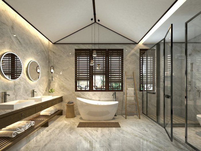 Remodeled bathroom with a freestanding tub and glass shower