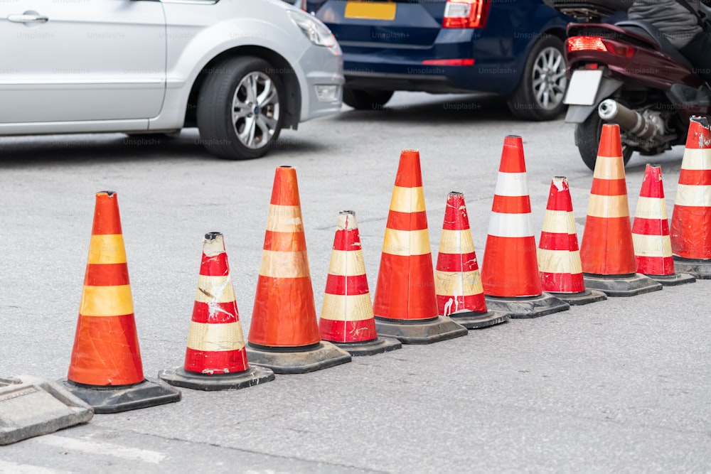 Special cones enclose and blocked the street with Construction work. Traffic jam due to detour