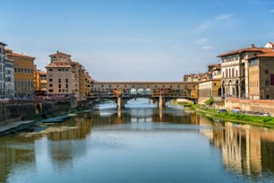 Florence Ponte Vecchio Bridge and City Skyline in Italy. Florence is capital city of the Tuscany region of central Italy. Florence was center of Italy medieval trade and wealthiest cities of past era.