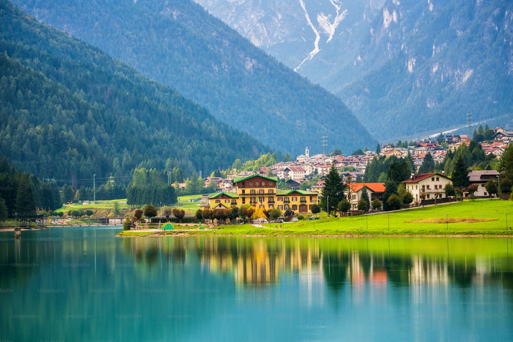 Beautiful mountain village landscape of Villapiccola and Lake Auronzo in Auronzo di Cadore, northern Italy. Nature and countryside panoramic landscape.