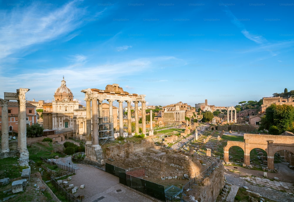 Roman Forum in Rome , Italy . Roman Forum was build in time of Ancient Rome as the site of triumphal processions and elections. It is famous tourist attraction of Rome , Italy .