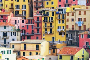 Colorful houses in Manarola Village, Cinque Terre Coast of Italy. Manarola is a beautiful small town in the province of La Spezia, Liguria, north of Italy and one of the five Cinque terre attractions.